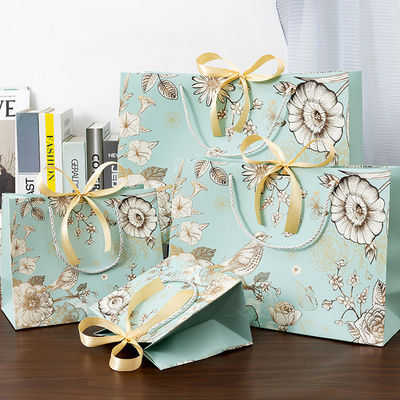 Sac en papier sur mesure en gros en papier écologique en magasinage emballage sac cadeau sac en papier imprimé avec votre propre logo