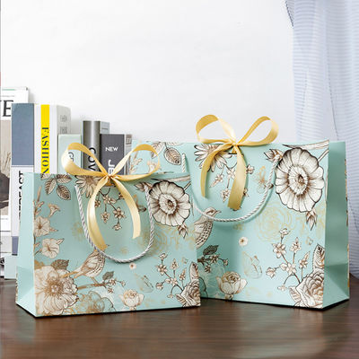 Sac en papier sur mesure en gros en papier écologique en magasinage emballage sac cadeau sac en papier imprimé avec votre propre logo